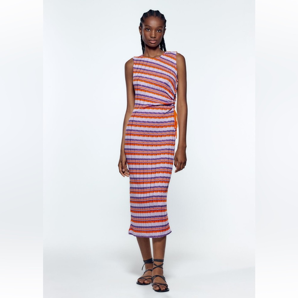 Worn once colorful striped dress with peakaboo side cut out detail
